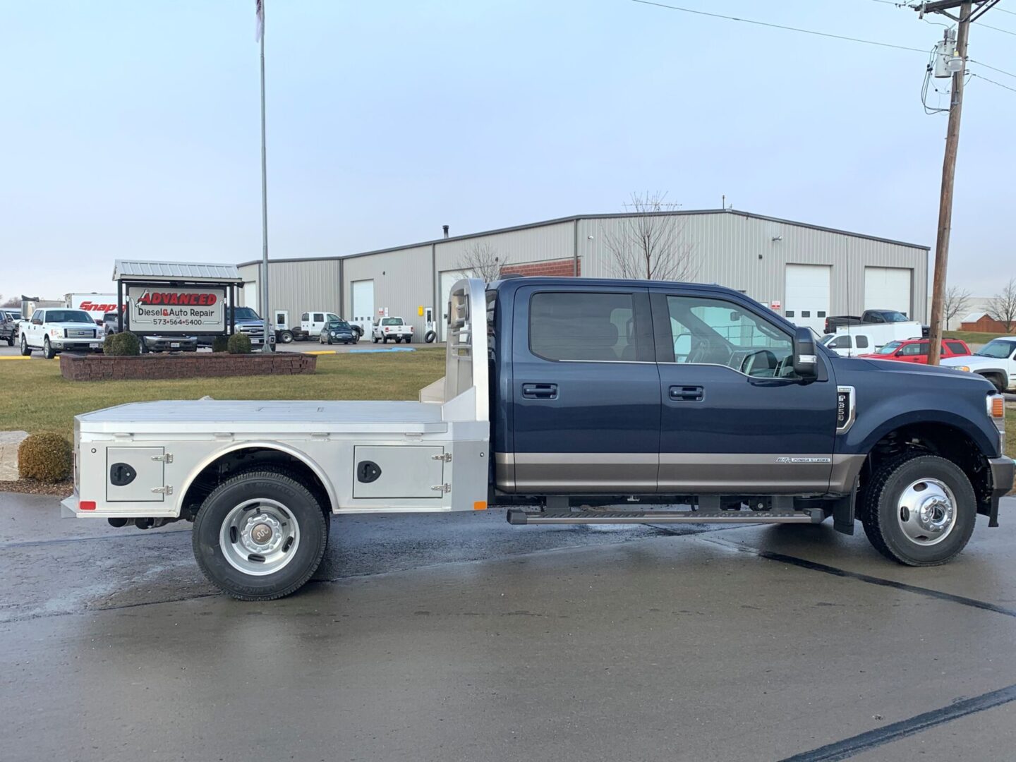 A truck is parked in the parking lot