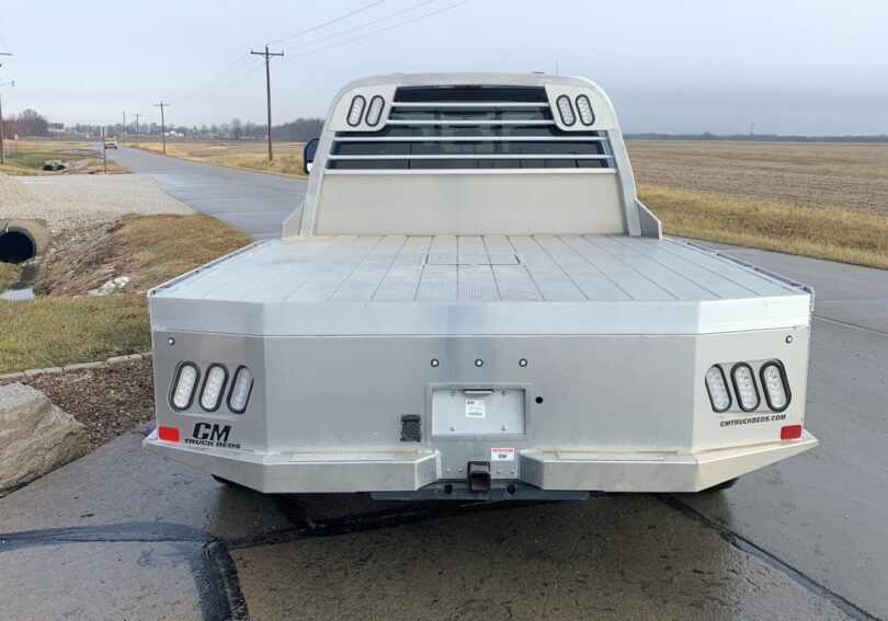 A truck is parked on the side of the road.